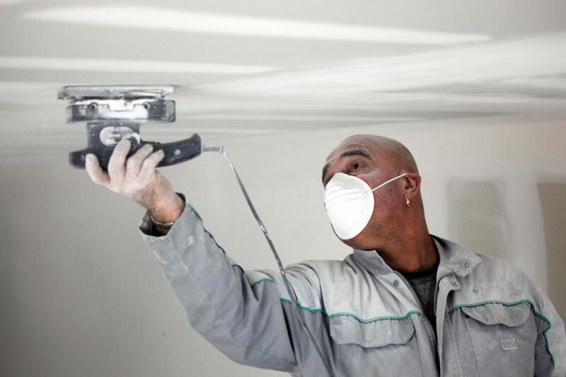 man polishing a ceiling